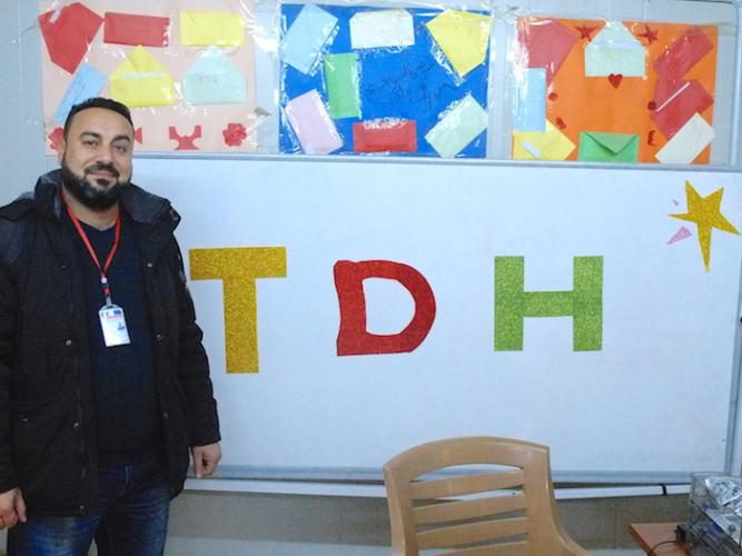 Ayad Hamed, a project manager with UNICEF partner TDH, works with at risk youth in the Debaga camp in northern Iraq.