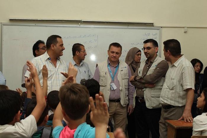 Radoslaw Rzehak, Chief of Field Office, UNICEF Aleppo (center) and other UNICEF staff visit students of Hatem Al Ta’i primary school in Aleppo few hours after an attack killed four children and injured three others on Thursday 14 October 2016.