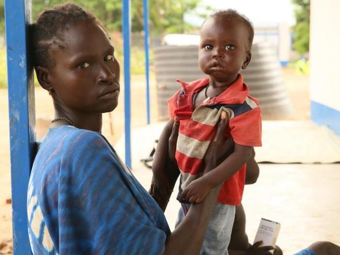 Bulo, photographed with his mother, recovered from severe acute malnutrition at a treatment center in rural South Sudan supported by UNICEF and partners.