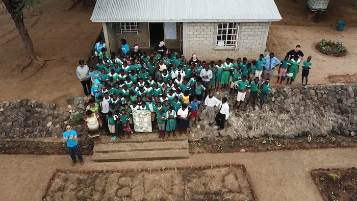 UNICEF Drone Corridor Lead Michael Scheibenreif shows local students how drones are particularly useful for aerial photography. The high-tech imagery captured by drones can be used to guide response efforts in the event of an emergency.