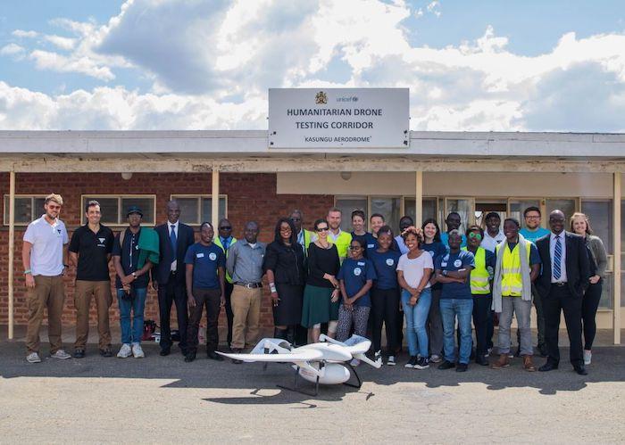 UNICEF Malawi staff and partners assemble to view bi-directional drone test flights at the Humanitarian Drone Testing Corridor in Kasungu, Malawi in 2019.