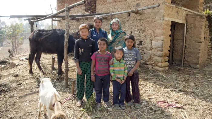 From left (front row), Magar sisters Sarita, 13, Deepa, 8, Reema, 6, and Bipana, 10, and (second row) Rita, 15, and Geeta, 17, are seen outside their damaged cowshed in Ramechhap, one of the 14 most earthquake affected districts in Nepal.