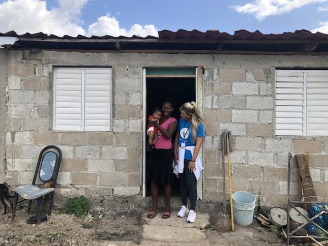 Danielle Kang visits a young mother and her baby during a field visit to the Dominican Republic with UNICEF Next Generation.