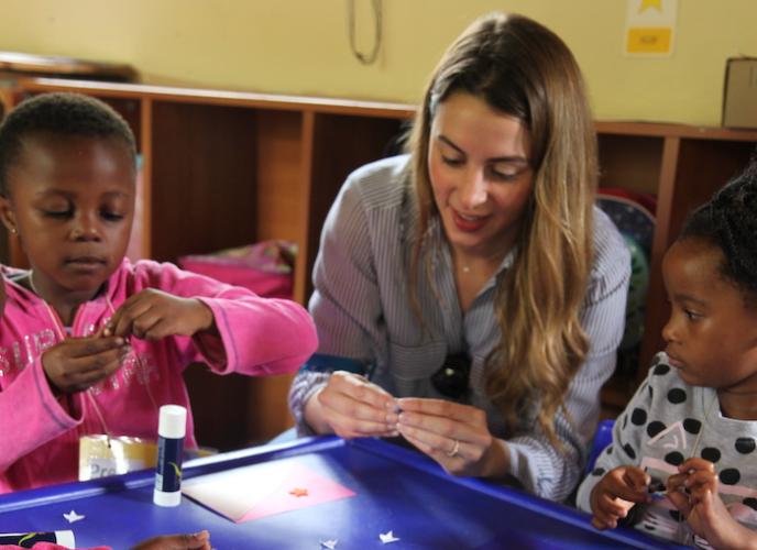 UNICEF Next Generation Global Principal Emily Watts Johnson connects with children during a UNICEF program visit to South Africa in 2021.