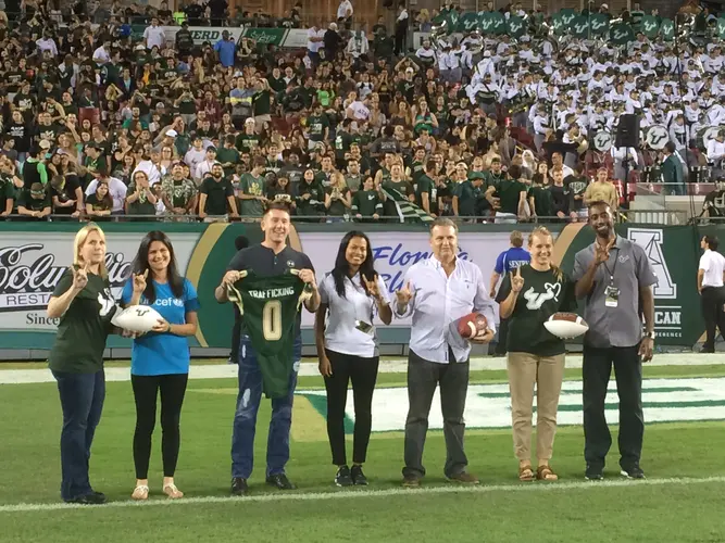 The U.S. Fund for UNICEF, the Florida Dream Center, and the NCAS are honored on the Football field during halftime. The U.S. Fund for UNICEF, the Florida Dream Center, and the NCAS are honored on the Football field during halftime.