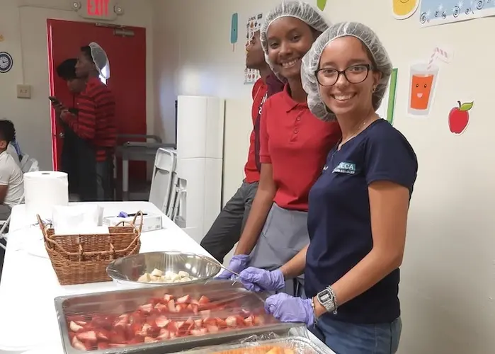 Kids at the Boys & Girls Clubs of Puerto Rico take turns helping out in the kitchen and serving food to their peers. Kids at the Boys & Girls Clubs of Puerto Rico take turns helping out in the kitchen and serving food to their peers.