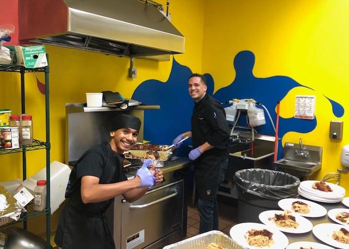 Seventeen-year-old Bryan (left) learned to love cooking after working with Chef David Ortiz in the kitchen of the Boys &amp; Girls Clubs of Puerto Rico. 