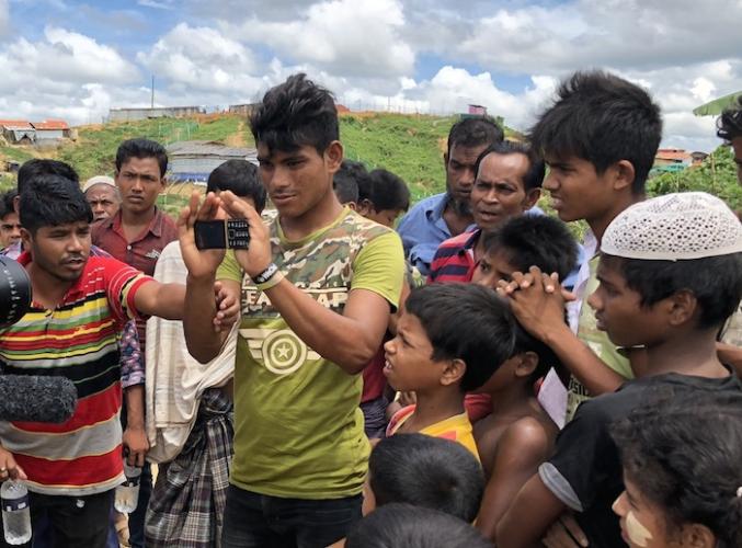 Rohingya refugees in Cox's Bazaar, Bangladesh, get a look at a new blockchain-enabled messaging service developed by the Banglesh-based startup W3 Engineers, a UNICEF Innovation Fund portfolio investment selected for follow-on funding from ETC Labs.