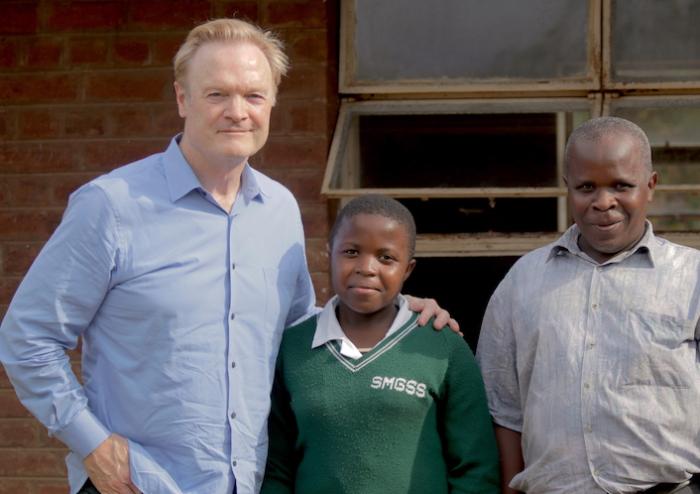 MSNBC's Lawrence O'Donnell (left) met student Joyce Chisale (center) during a 2016 visit to Malawi in support of the UNICEF/K.I.N.D. Fund.