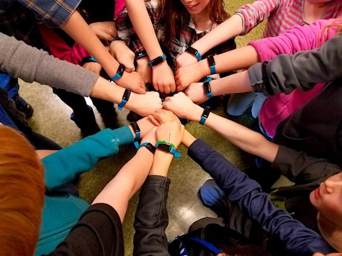 Kasey Bird's third-grade class shows off their UNICEF Kid Power Bands.
