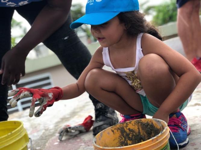 Kayli, 6, helped student volunteers do post-hurricane roof repairs in Guaynabo, Puerto Rico.
