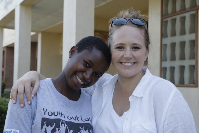K.I.N.D. scholarship recipient Rehema, left, with UNICEF USA's Lauren Davitt in Namwera, Malawi.