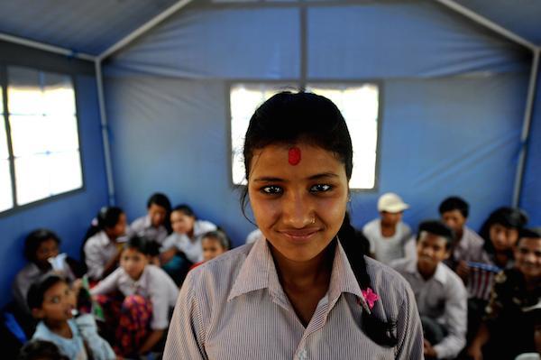 Laxmi Giri, 16, inside the makeshift tent school of Shree Balephi Secondary School. 