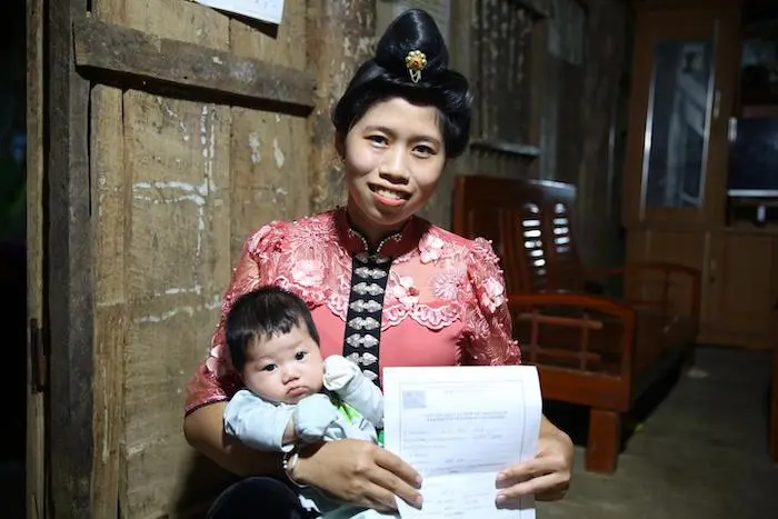 Lo Thi Son holds her baby at home in Huoi Sua, a remote village in northern Vietnam. Lo Thi Son holds her baby at home in Huoi Sua, a remote village in northern Vietnam.