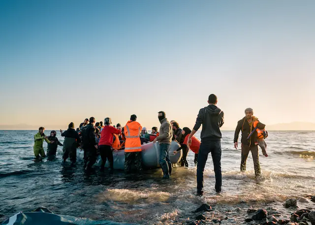 Refugees arriving on the shores of Greece.
