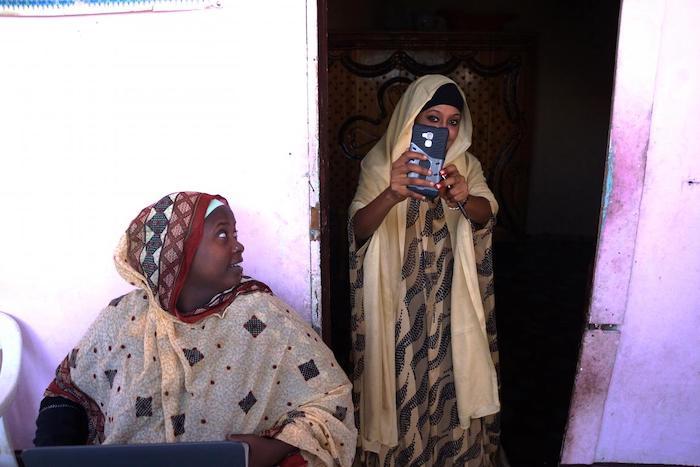 Mariam Kako, left, is a UNICEF-trained volunteer in Djibouti who works with mothers like Aicha to persuade them not to subject their daughters to FGM.