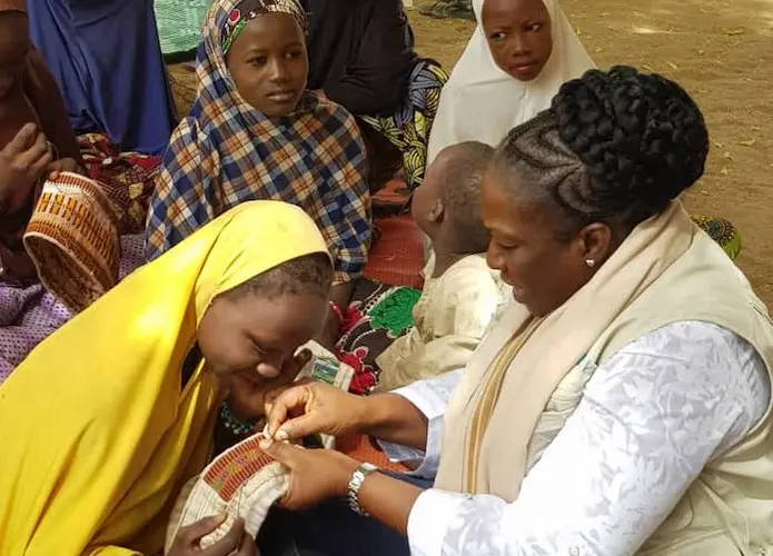 Miatta Abdullai Clark, far right, is a a child protection worker in Maiduguri, Borno State, Nigeria. 