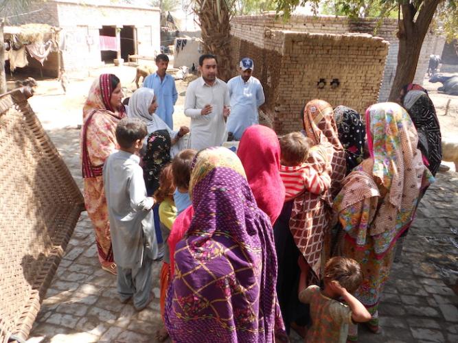 District Vaccinator Supervison Waseem Siyal briefs a rural community in Pakistan on the importance of vaccinations. 
