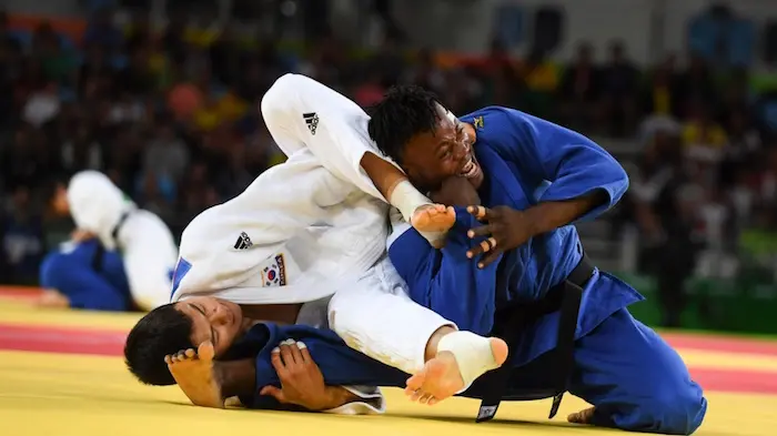 In his second bout of the day, Popole faced Donghan Gwak, a former world champion who went on to win the bronze medal. © UNHCR/Benjamin Loyseau
