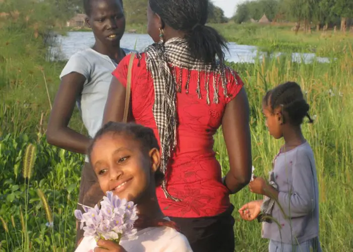 On a return trip to South Sudan in 2009, Rebecca Deng picked flowers with children in the village of Atar, about an hour away by boat from the city of Malakal.