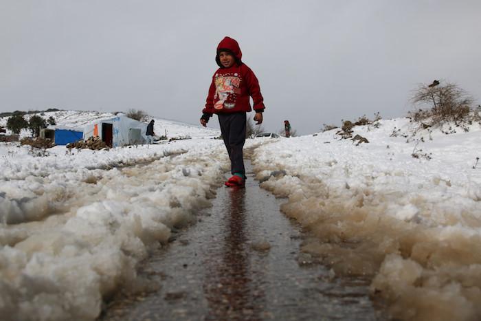 Laith, 6, lives in a camp for internally displaced people in rural Quneitra, Syrian Arab Republic, where heavy snow falls in winter. 