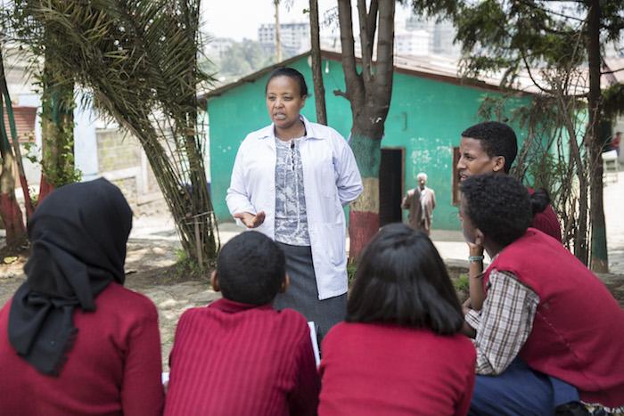 Netsanet Abebe, Vice Director of a junior secondary school in Addis Ababa, Ethiopia, meets with members of the school's gender club to discuss ways to combat violence against girls. 