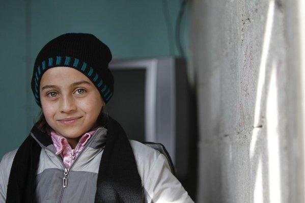 Teba and her family have been displaced six times in Syria over the last three years. They live in a poorly insulated building outside Damascus so the clothes UNICEF gave her will get her through the winter