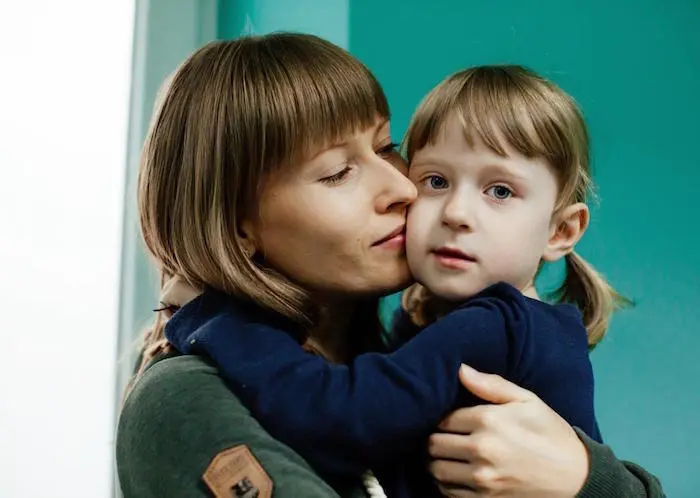 A 4-year-old girl hugs her mother in a child development center supported by UNICEF in Lviv, Ukraine A 4-year-old girl hugs her mother in a child development center supported by UNICEF in Lviv, Ukraine