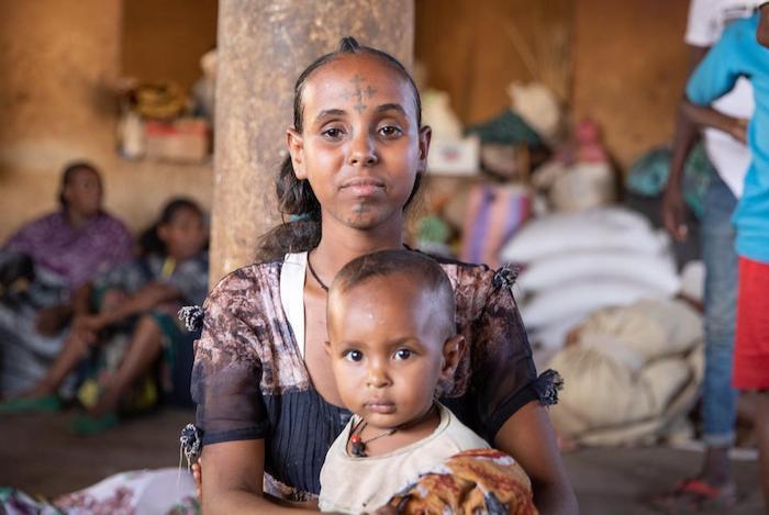 A mother and son get support from UNICEF at the Mai Tsebri site for families internally displaced by ongoing conflict in Tigray, Ethiopia.
