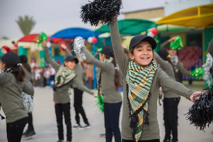 Children perform at a UNICEF-supported school in Baghdad. Children perform at a UNICEF-supported school in Baghdad.