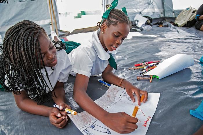 Children in Anguilla drawing during a “Return to Happiness” session designed to help kids get back on track after Hurricanes Irma and Maria devastated the island territory and many of its neighbors. 