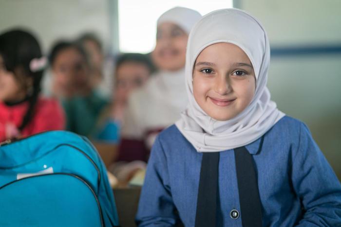 Syrian refugee Sadeen, 10, built a house out of Lego bricks at school in Za'atari Refugee Camp in Jordan. One day, she hopes to build a real house for her family. 