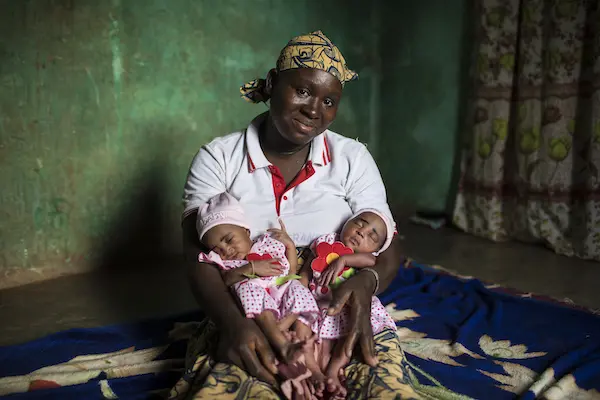 Fatoumata of Bougouni, Mali, pictured above with newborn twin daughters Foune and Wassa, is the mother of five children, all of whom have received a full course of immunizations through a UNICEF-supported program. "All my five children are very healthy," Fatoumata of Bougouni, Mali, pictured above with newborn twin daughters Foune and Wassa, is the mother of five children, all of whom have received a full course of immunizations through a UNICEF-supported program. "All my five children are very healthy,"