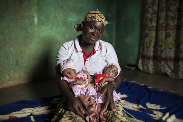 Fatoumata of Bougouni, Mali, pictured above with newborn twin daughters Foune and Wassa, is the mother of five children, all of whom have received a full course of immunizations through a UNICEF-supported program. "All my five children are very healthy," 