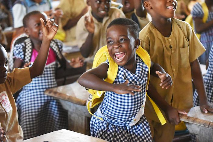 Children show their enthusiasm and friendship during class in Gonzagueville, in the South of Côte d’Ivoire.