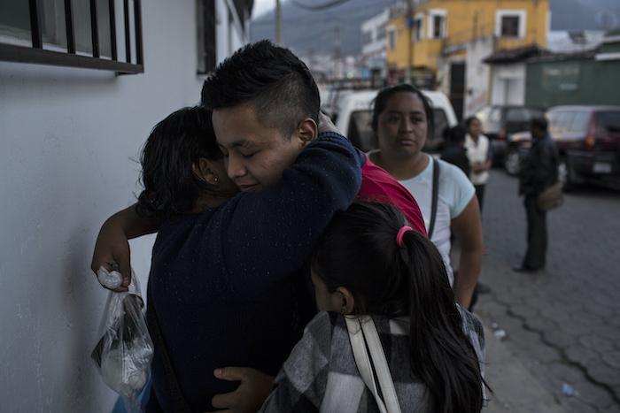 A family reunites at a government reception shelter in&nbsp;Quetzaltenango, Guatemala.
