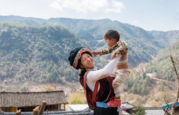 A mother and her baby who benefited from a UNICEF cash assistance program in China's Yunnan province.