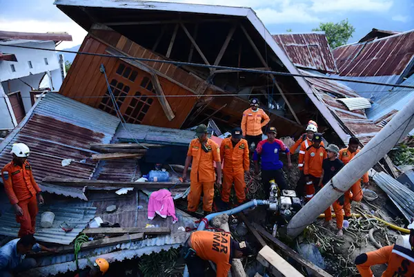 On 30 September 2018 in Indonesia, Basarnas evacuates earthquake victims at the Balaroa National Park, West Palu, Central Sulawesi, after the earthquake and tsunami that struck Sulawesi on September 28.