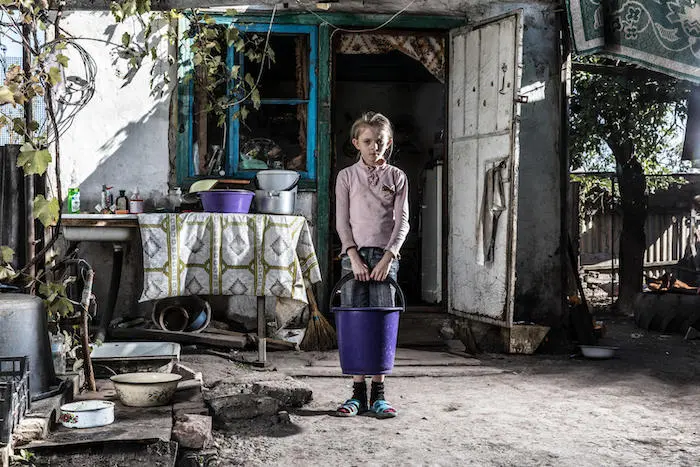 Nine-year-old Sasha at home in Bakhmutka, Donetsk, eastern Ukraine. Nine-year-old Sasha at home in Bakhmutka, Donetsk, eastern Ukraine.