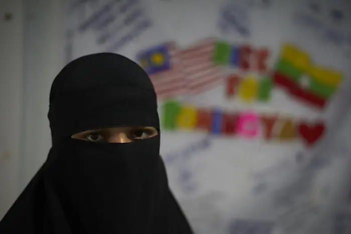 After Meena's family fled Myanmar after her father was murdered. When her family fled on a boat, traffickers attempted to sell her. After Meena's family fled Myanmar after her father was murdered. When her family fled on a boat, traffickers attempted to sell her.