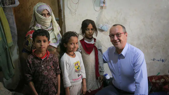 UNICEF Regional Director for Middle East and North Africa Geert Cappalaere visits a family benefiting from the Emergency Cash Transfer program in Sana'a, Yemen in October 2018.