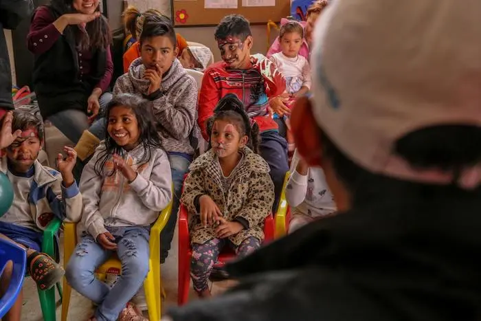 Children learn about the importance of handwashing with soap at a UNICEF-supported Child Friendly Space in Ecuador.
