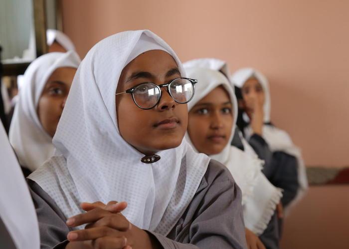 Girls attend class at the UNICEF-supported Ibn Zaidoon School in Aden, Yemen in December 2018.