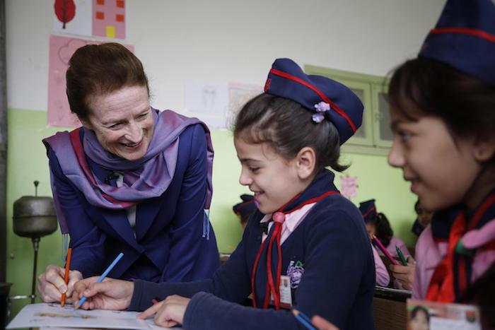 In December 2018, UNICEF Executive Director Henrietta H. Fore (left) chats with children at a Mine Risk Education class at Al-Mahatta Al-Awla primary school in Izra city, in Dara’a, southern Syria. 