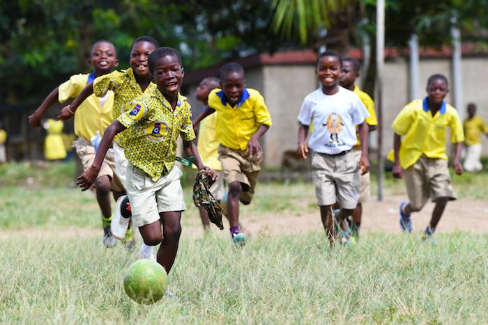 Boys playing football outside the Asuokaw Methodist School in eastern Ghana.