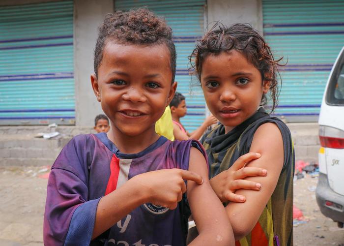 Children in Aden, Yemen proudly show off the spots on their arms where they were vaccinated during a mobile Measles and Rubella vaccination campaign backed by UNICEF in February 2019.