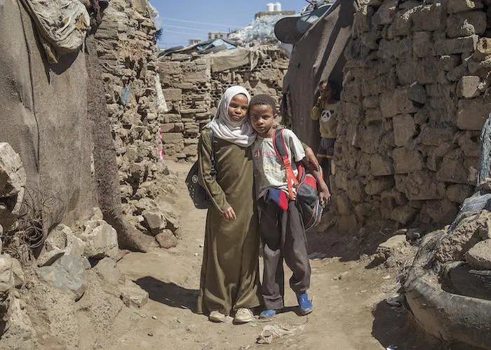 Rania, 12, missed a year of school in Dar Salm, Yemen. Now in the sixth grade, she's tutoring her brother in math.