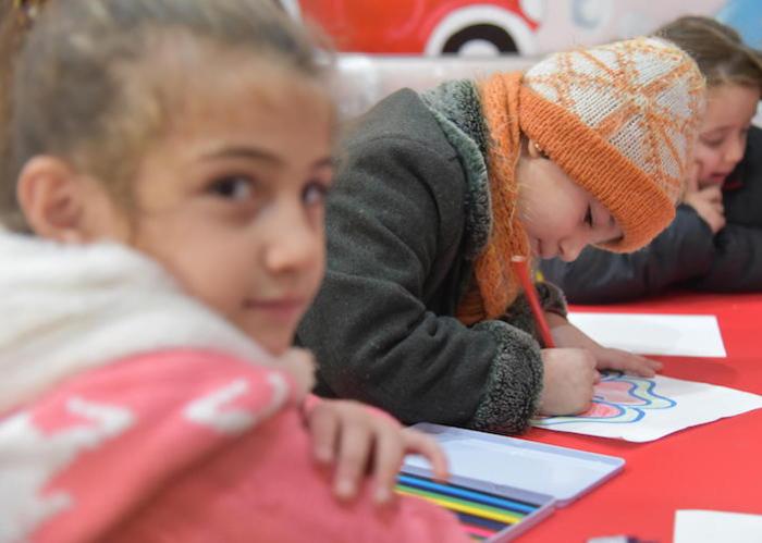 Five-year-old Fatme (center) enjoyed her first day of UNICEF-supported preschool in Aleppo, Syria in 2019.