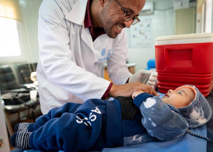 In April 2019, Dr. Almanti, Ministry of Health coordinator, vaccinates 4-month-old Malek in the UNICEF-supported health clinic in Azraq Refugee Camp in Jordan. 