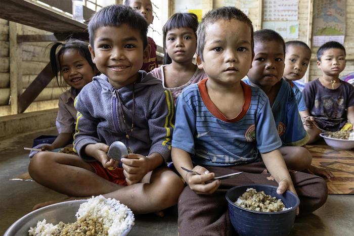 UNICEF helps make sure preschool children get a nutritious meal during their lunch break at Tahouak Primary School, Ta Oi District, Saravane Province, Laos.